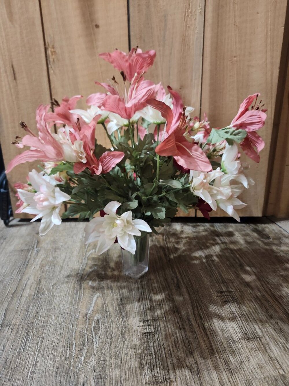vintage floral arrangement of artificial flowers in small vase